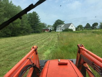 Bush Hogging deep thick grass with tractor in Kennebunk Kennebunkport Arundel Wells Moody Ogunquit Maine ME Ambidextrous landscaoing Inc